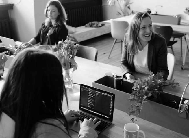 header image, people in a meeting